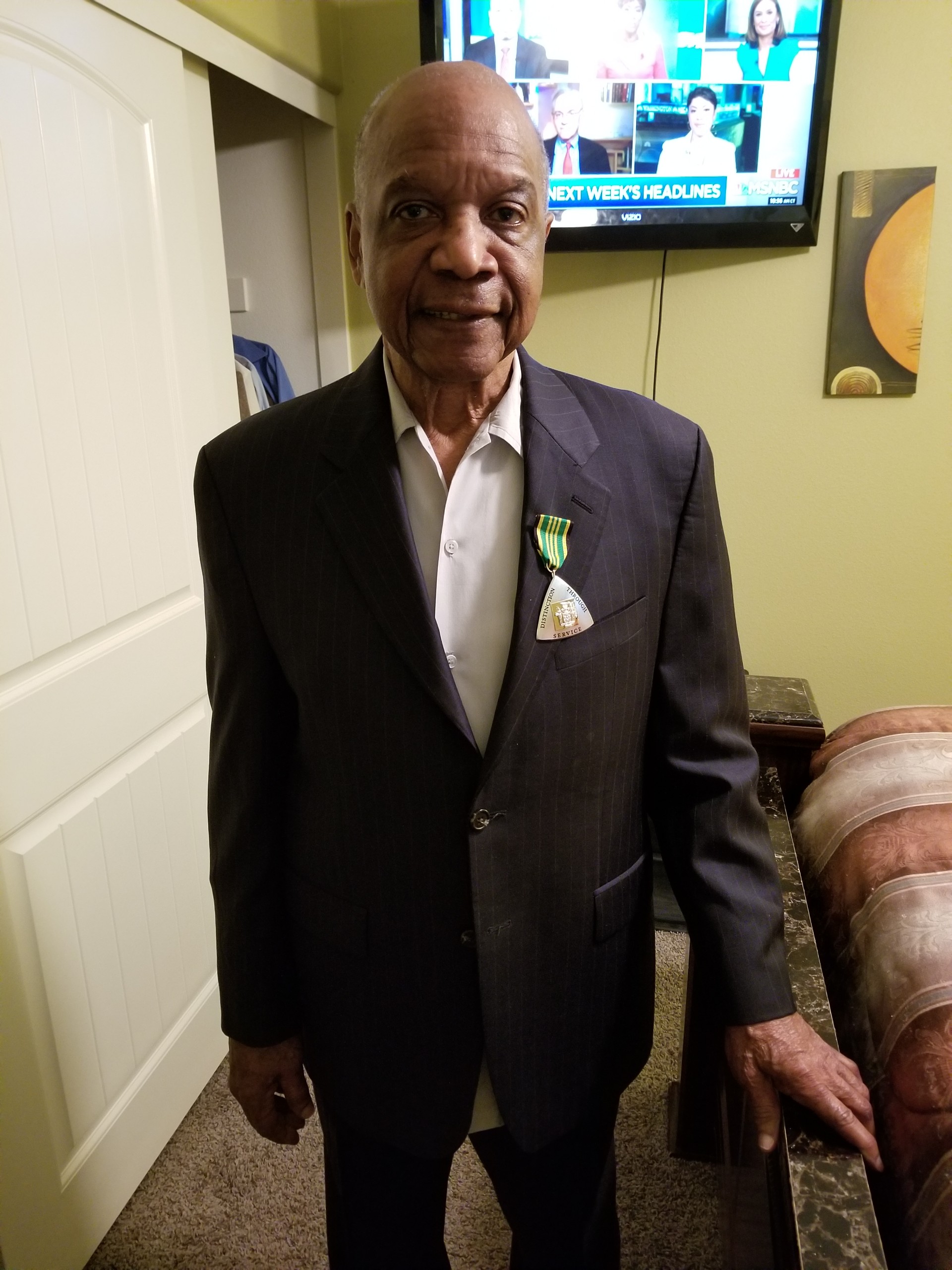 Carlos Malcolm's Order of Distinction pin